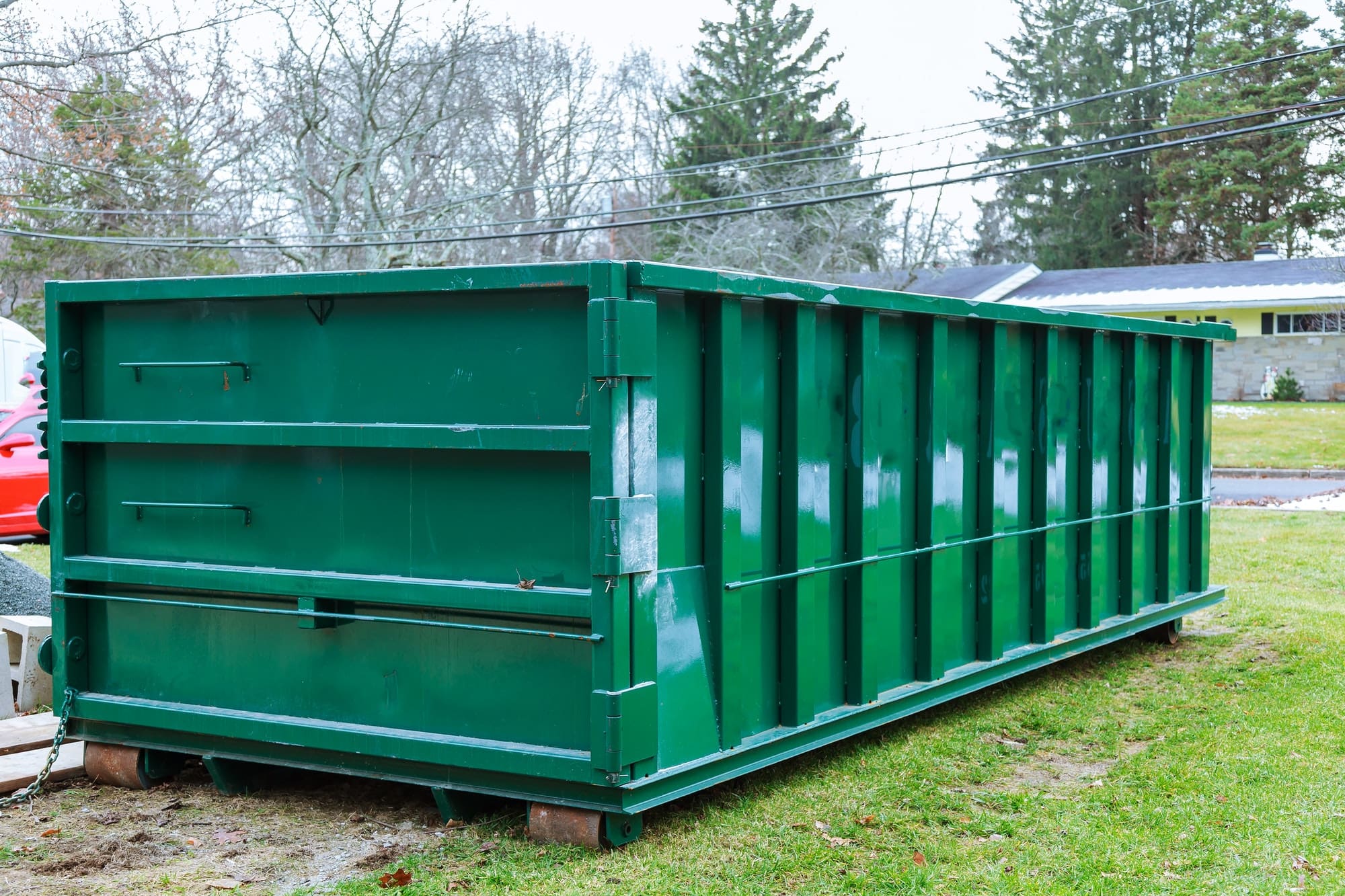 Green 30-yard dumpster ideal for large projects, exemplifying the importance of choosing the right dumpster size.